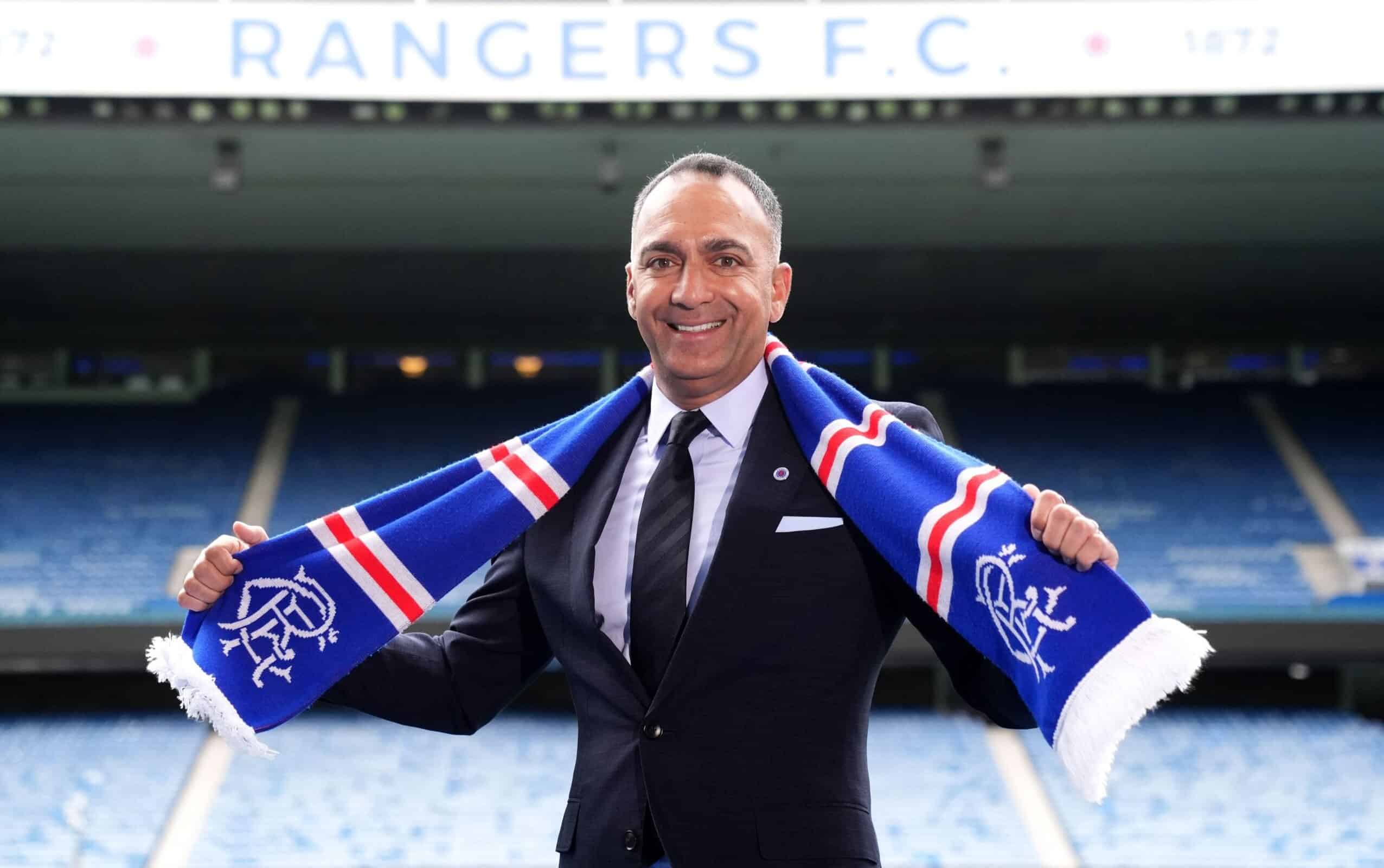 Leeds United chairman — and Rangers vice-chairman — Paraag Marathe poses in a Rangers scarf at Ibrox Stadium