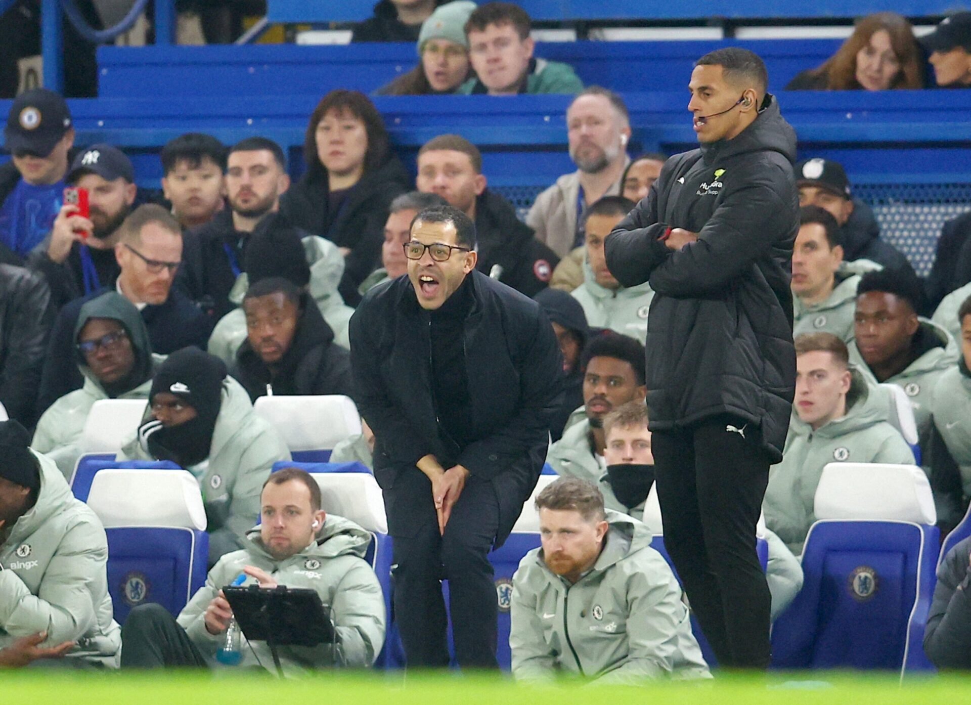 Liam Rosenior screams at...someone from the dugout at Stamford Bridge. Annoying guy, isn't he?