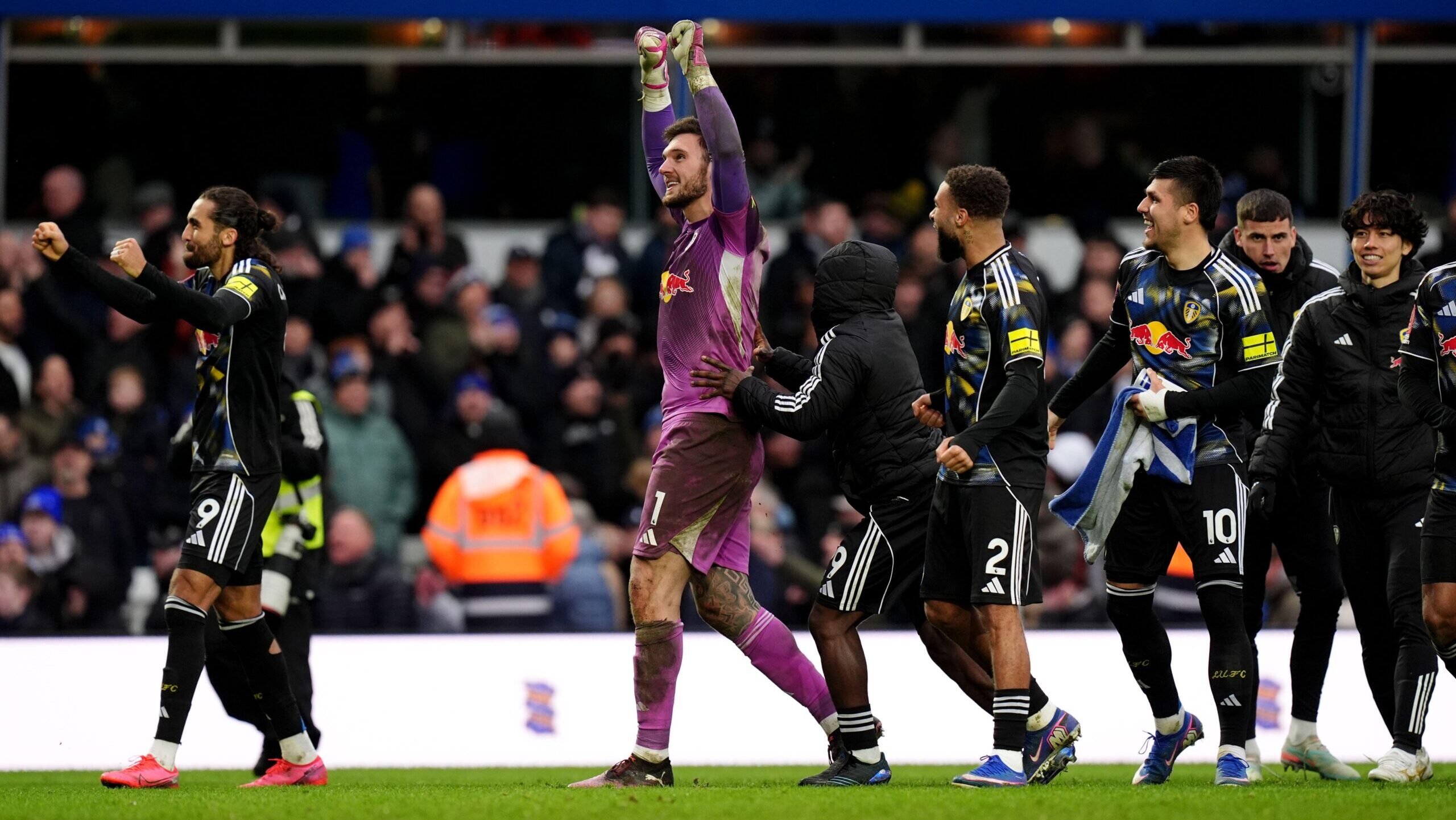 Lucas Perri celebrates with his arms aloft after saving a penalty in Leeds' shootout win