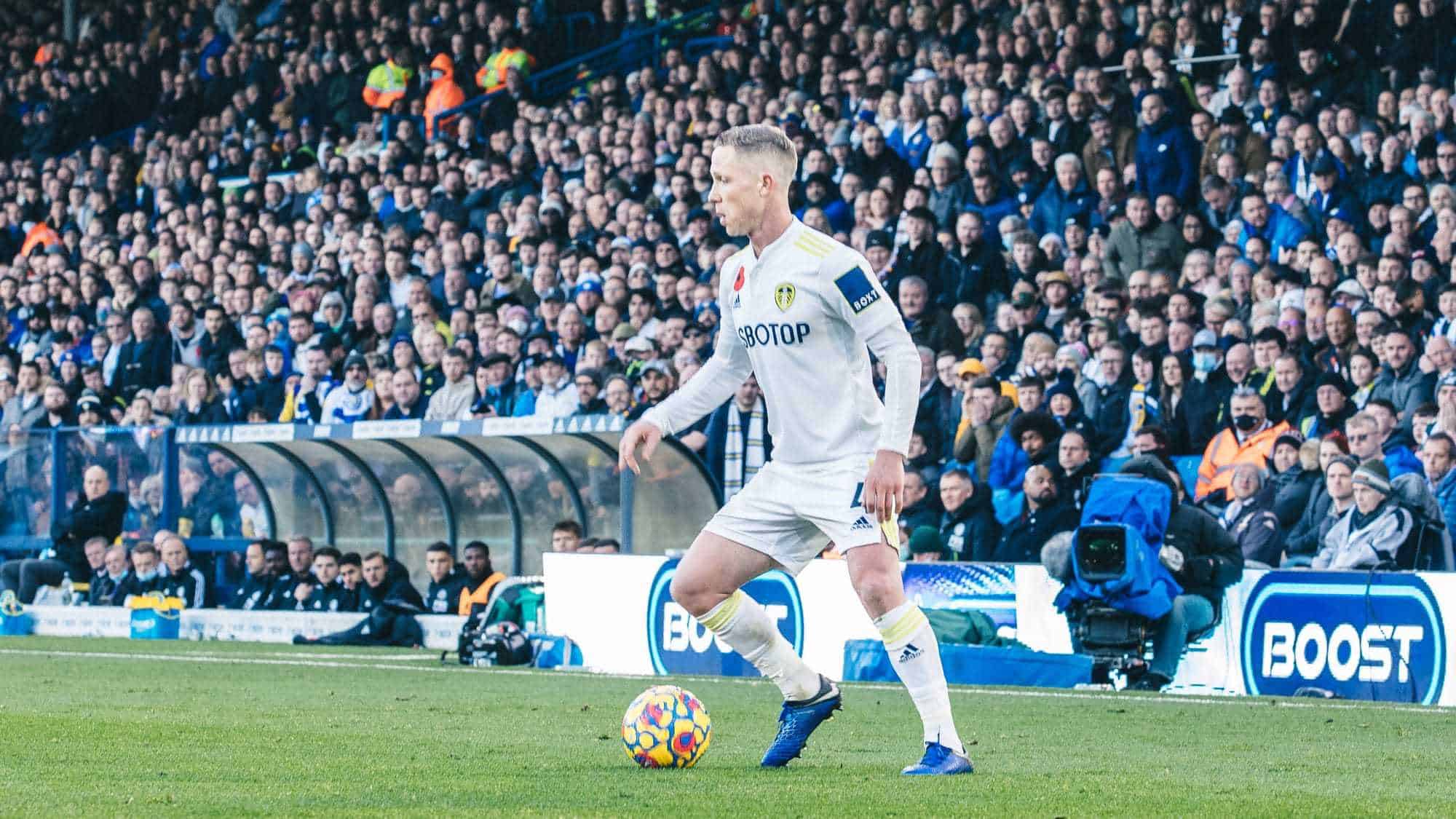 Adam Forshaw poised with the ball at his feet against Leicester