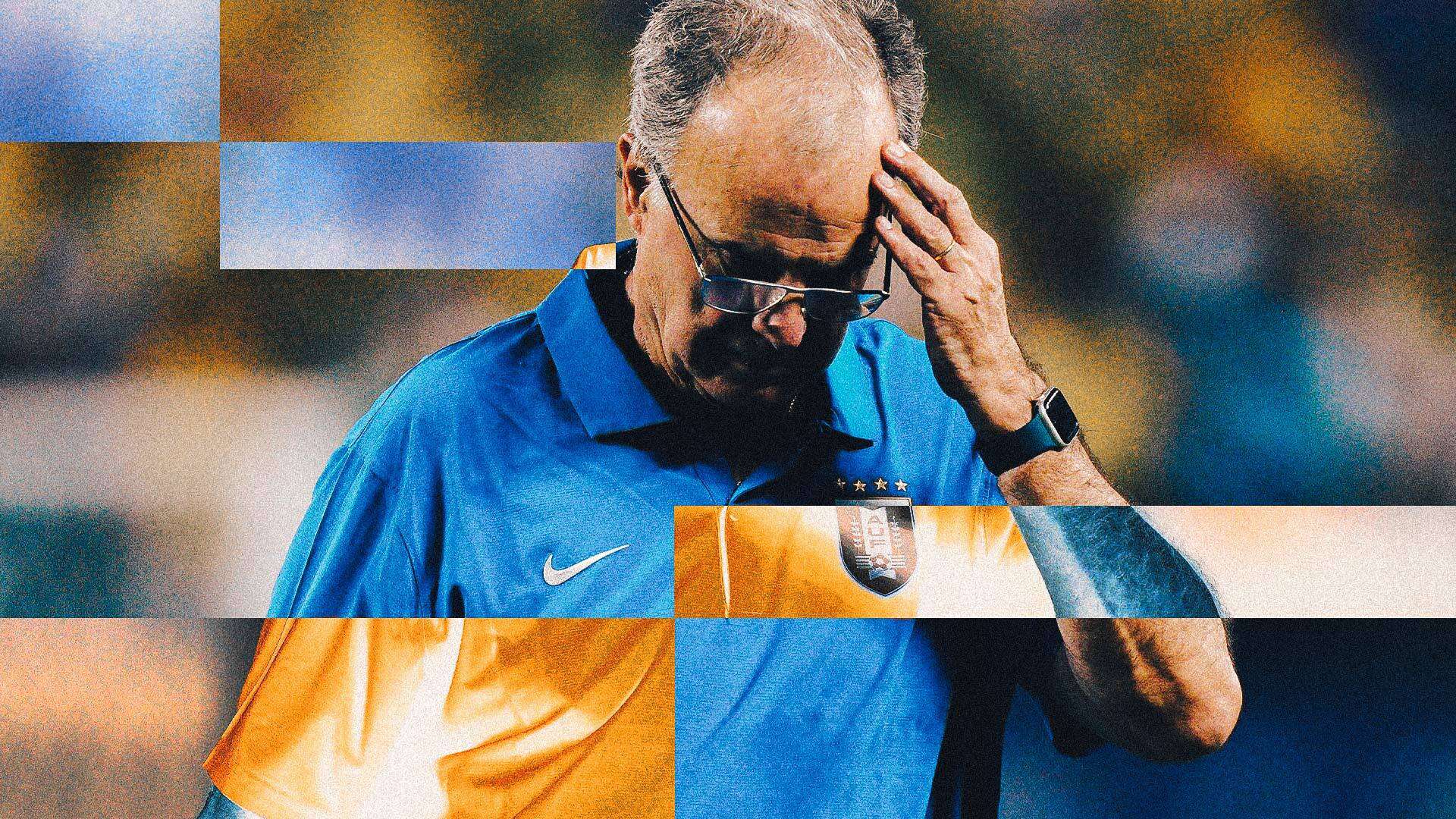 An image of Marcelo Bielsa putting his hand to his head and looking at the ground during Uruguay's 1-0 defeat to Colombia in the Copa America semi-final