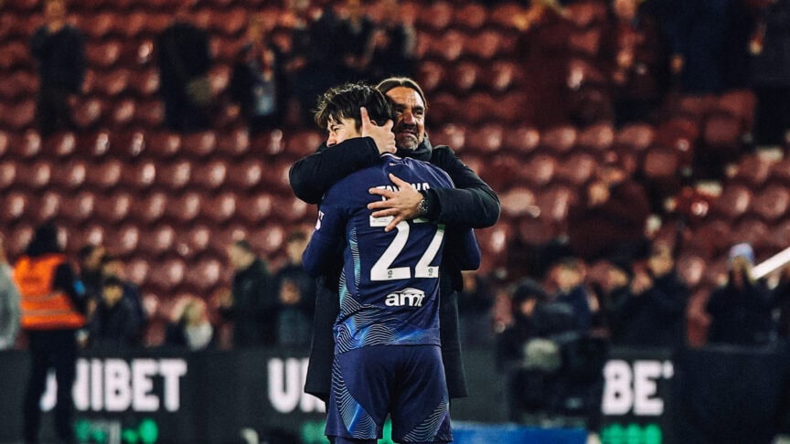 Ao Tanaka and Daniel Farke embrace at the end of an exhausting Leeds win.