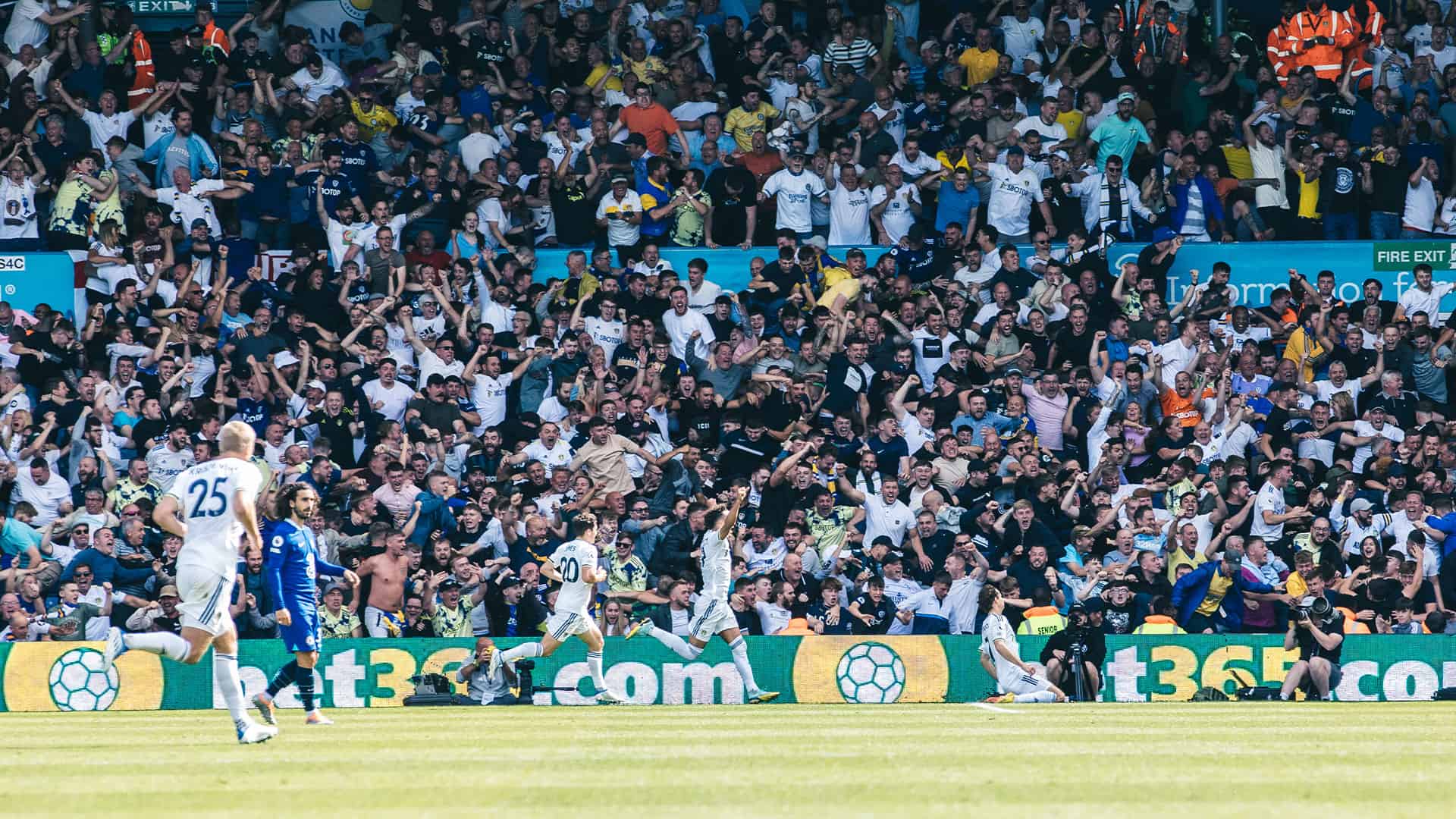 Brenden Aaronson celebrating his goal against Chelsea with a full view of the South Stand going mad