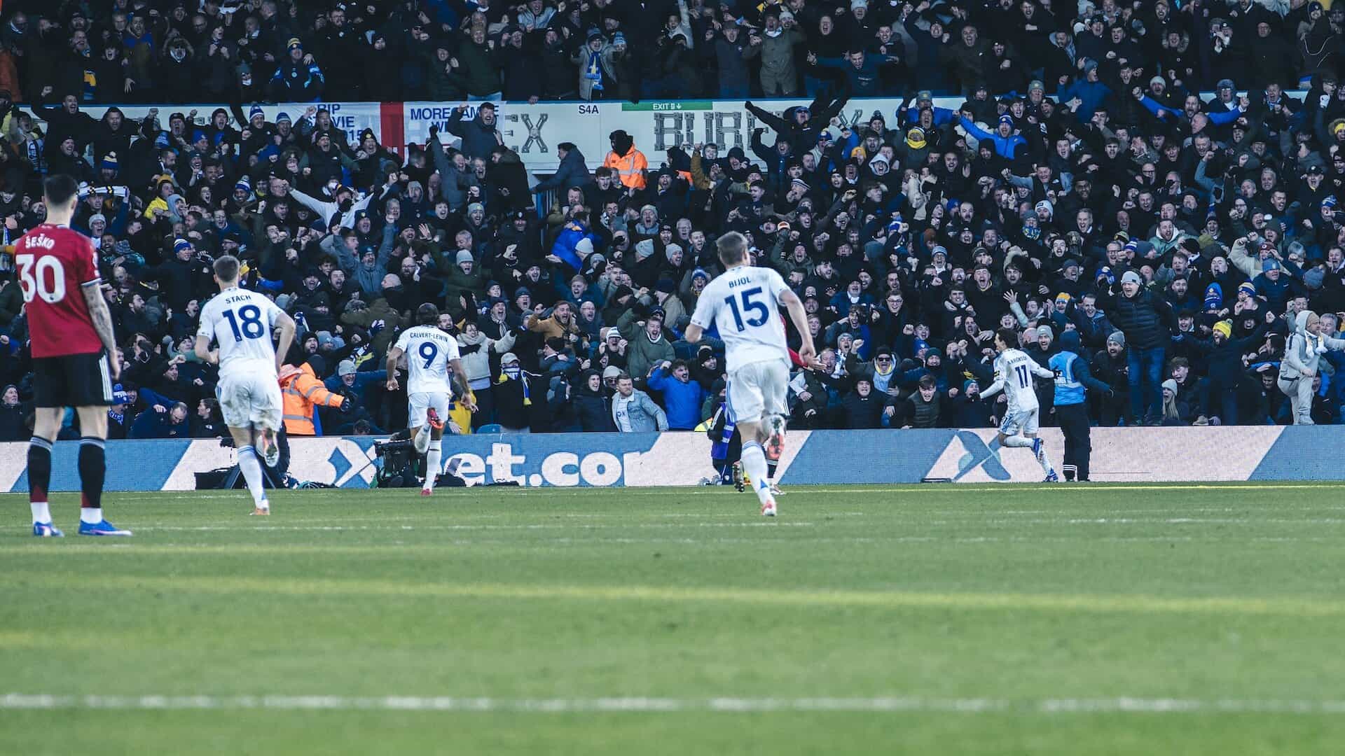Brenden Aaronson runs towards the south stand with Jaka Bijol, Anton Stach and Dominic Calvert-Lewin chasing after him