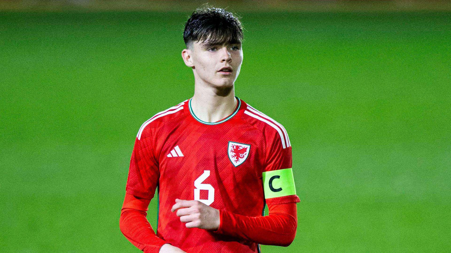 Leeds U21s midfielder Charlie Crew playing for Wales U17s and wearing the captain's armband. He's got a big sweepy fringe 'cos he's young