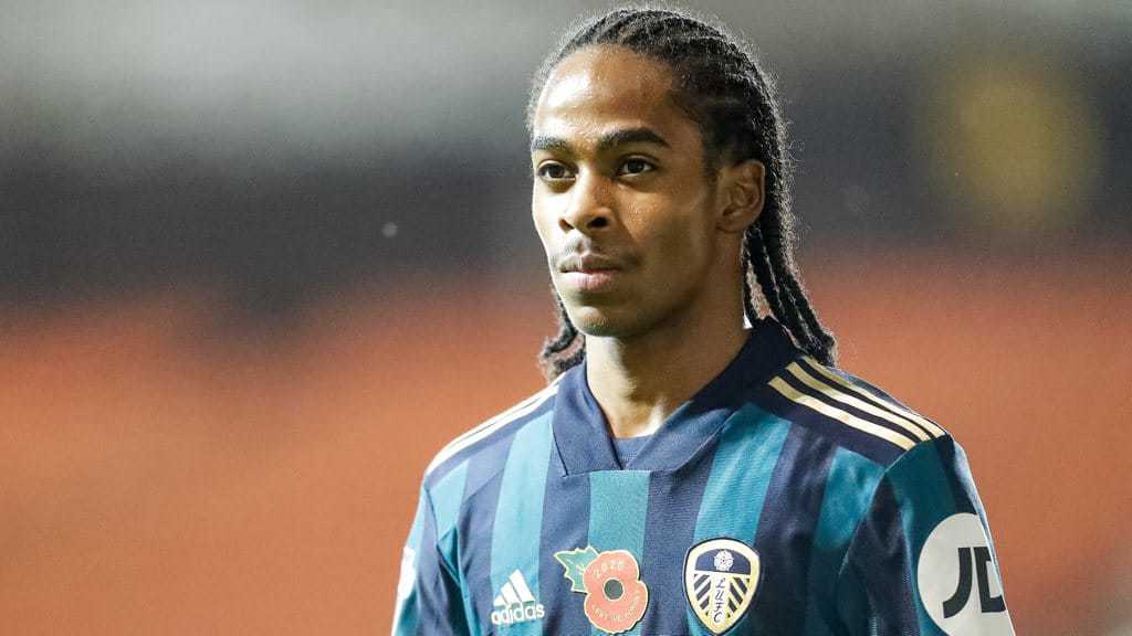 A photo of Crysencio Summerville playing for Leeds in the blue and green away kit in 2020