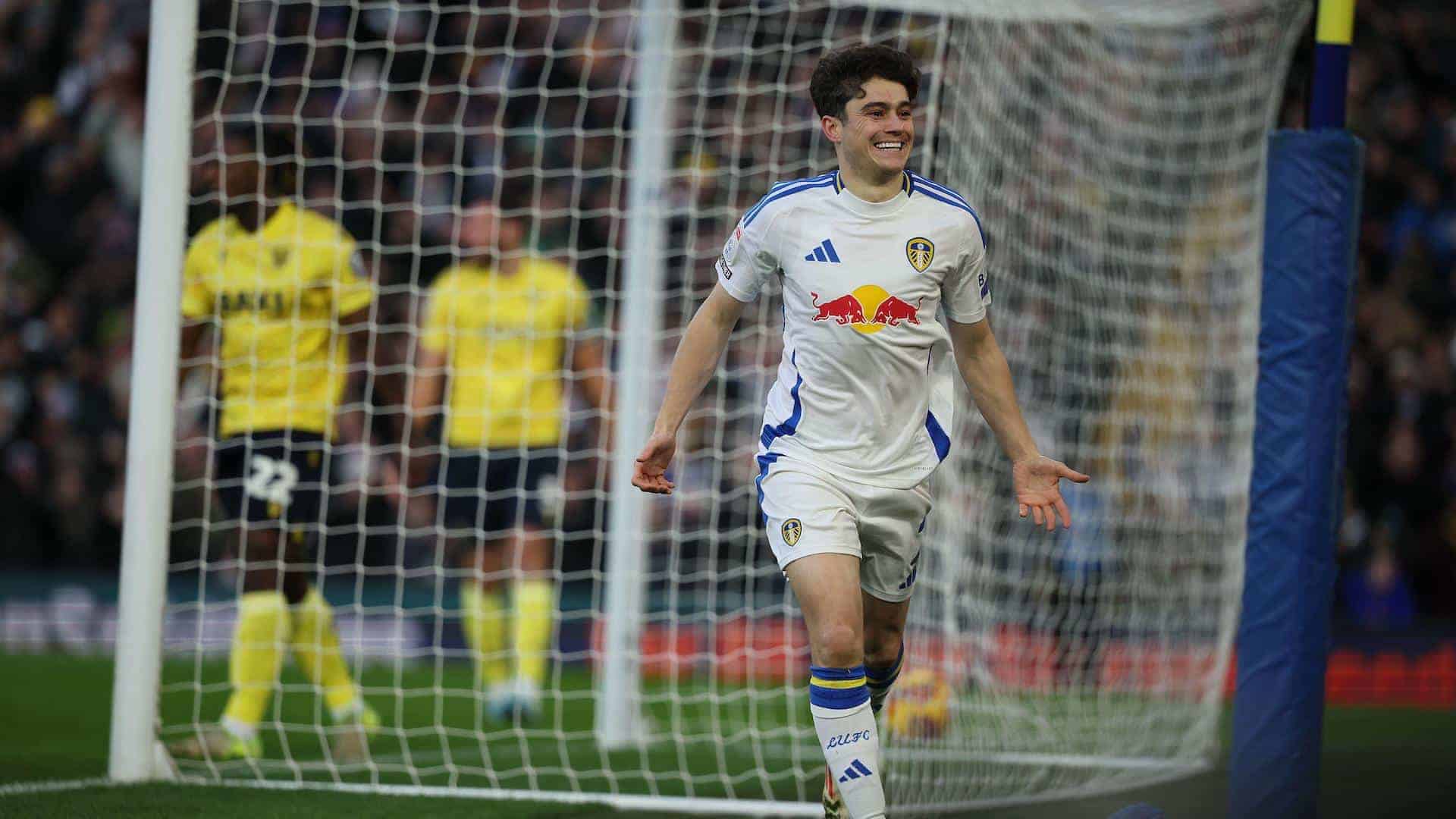 Dan James running off to the South Stand with a big cheesy grin after scoring the opener against Oxford United. Two of their chumps are standing in the background looking sad