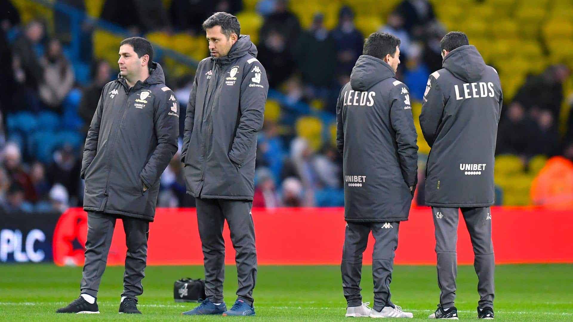 Diego Flores during his time at Leeds, looking very cold with his coaching jacket zipped up to the top and his chin tucked in