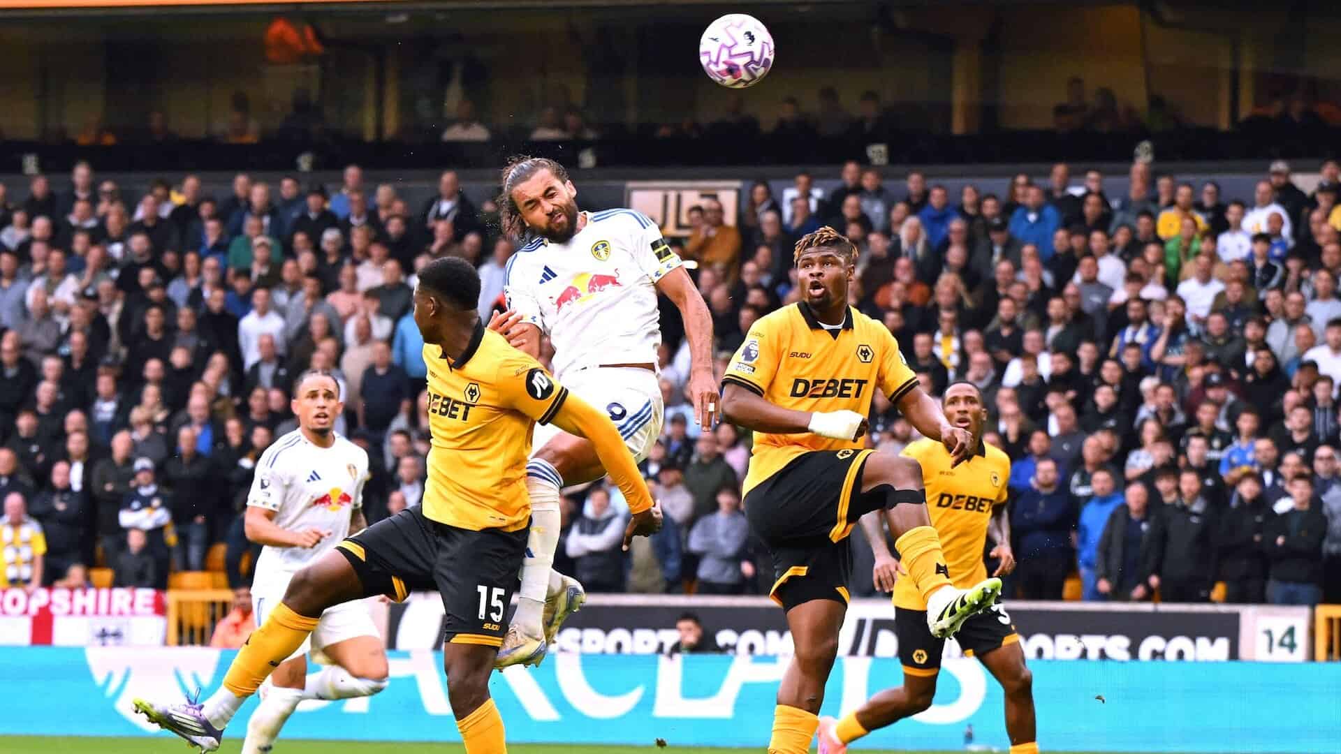 Dominic Calvert-Lewin pulling a funny face as he leaps into the air to head a brilliant equaliser for Leeds at Wolves
