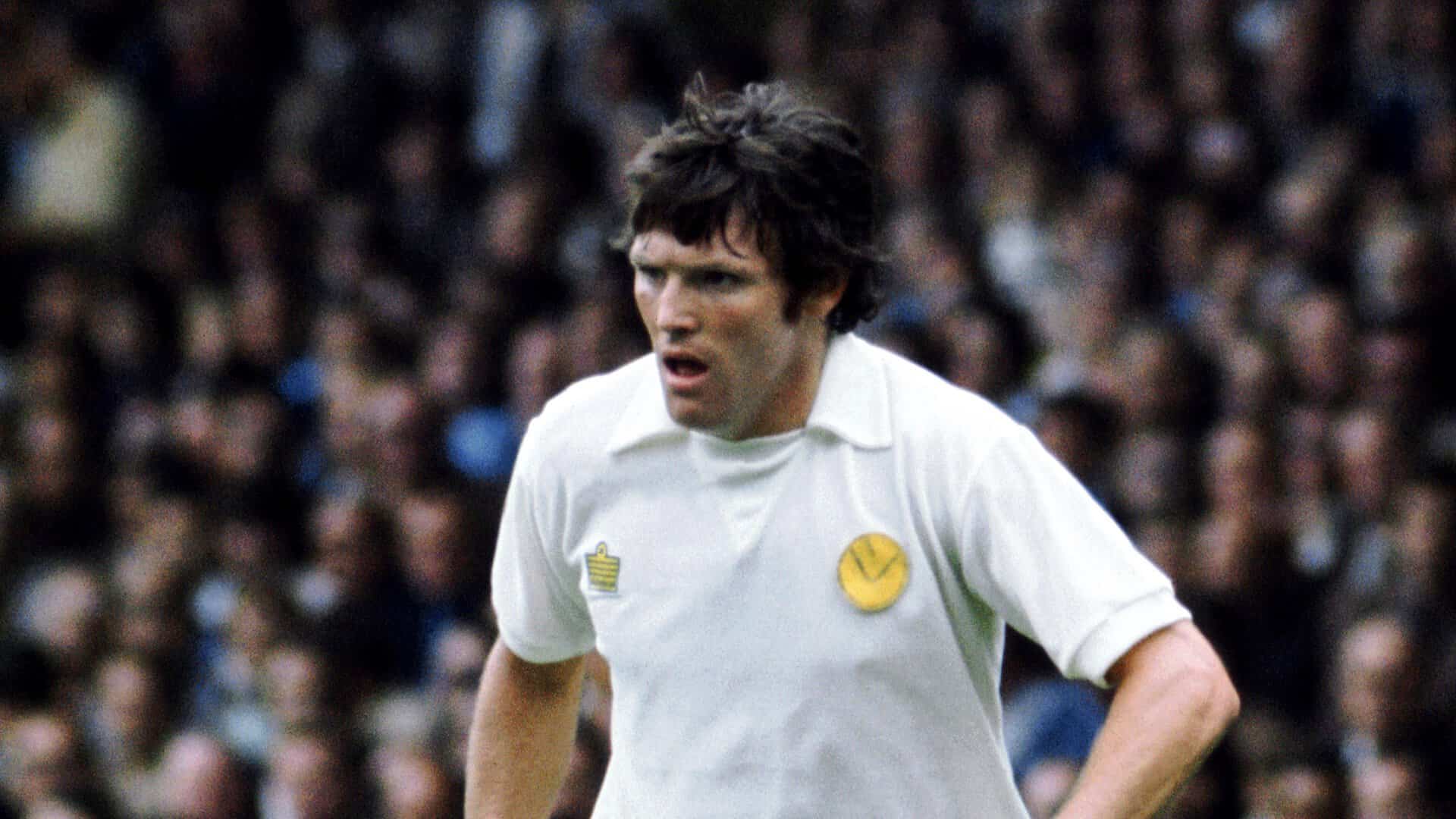 Eddie Gray in his Super Leeds days, dribbling with the ball at his feet, his elbow typically cocked as he points a teammate into space