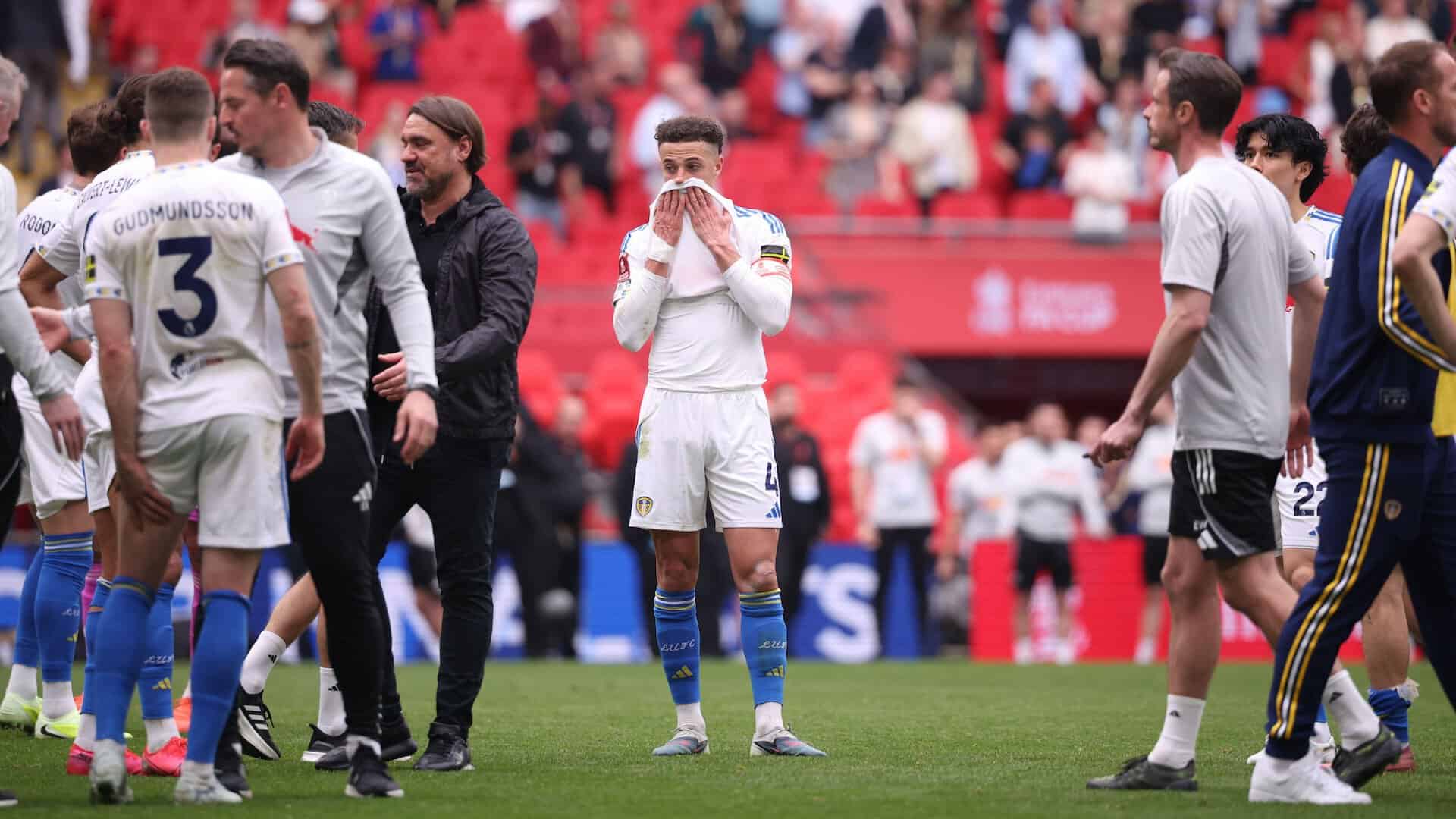 Ethan Ampadu buries his face in his shirt at full-time of Leeds' semi-final defeat to Chelsea. Same, mate. To the left, Gabi Gudmundsson stands holding his hamstring. FFS.