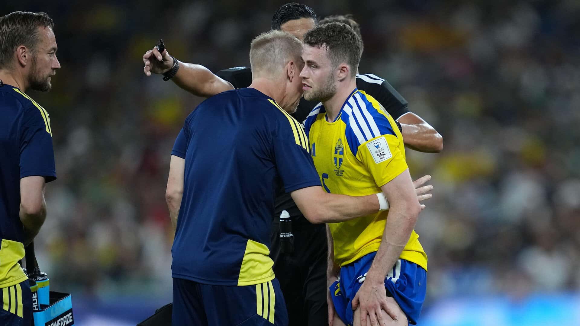 Gabriel Gudmundsson limps off an hour into Sweden vs Tunisia, pulling his shorts up while getting a hug from a coach