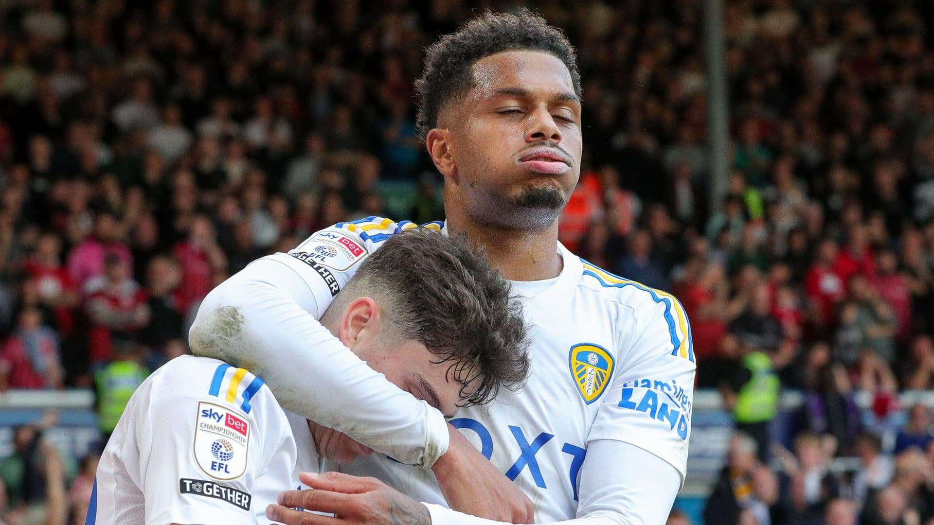 Georginio Rutter is celebrating United's opening goal against Bristol City by closing his eyes and sighing with relief, with scorer Dan James tucked under his arm