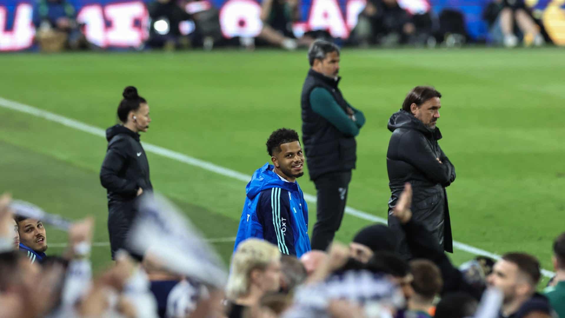 Georginio Rutter, after being subbed off, is picked out by a photographer in the West Stand, as he looks up across the crowds with joy on his face