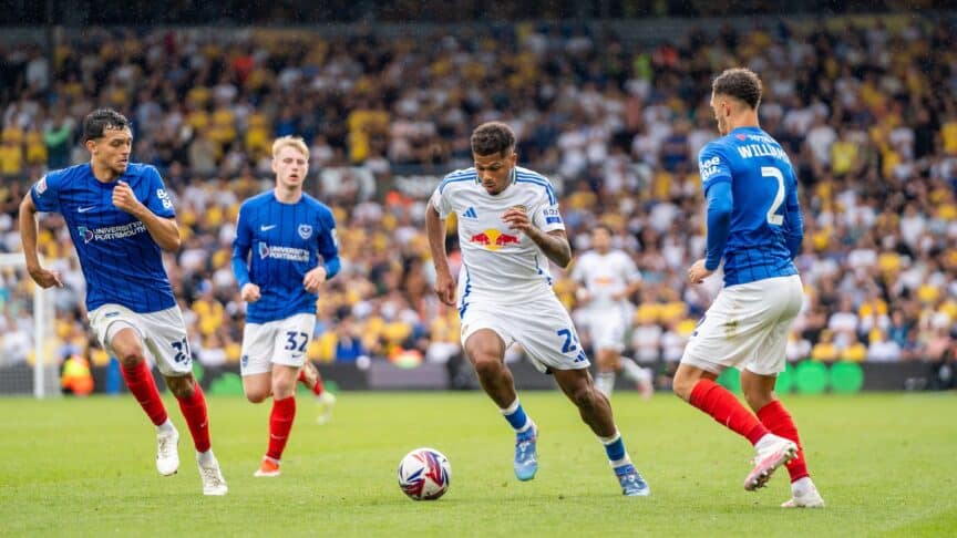 Georginio Rutter (remember him?!) dribbling with the ball surrounded by three Portsmouth players on the opening day of the season at Elland Road (remember that?!)