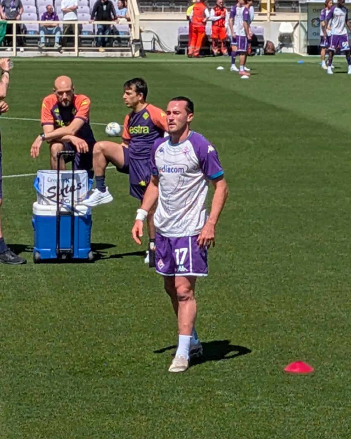 Jack Harrison looking rather sunburnt in the blistering heat as he warmed up