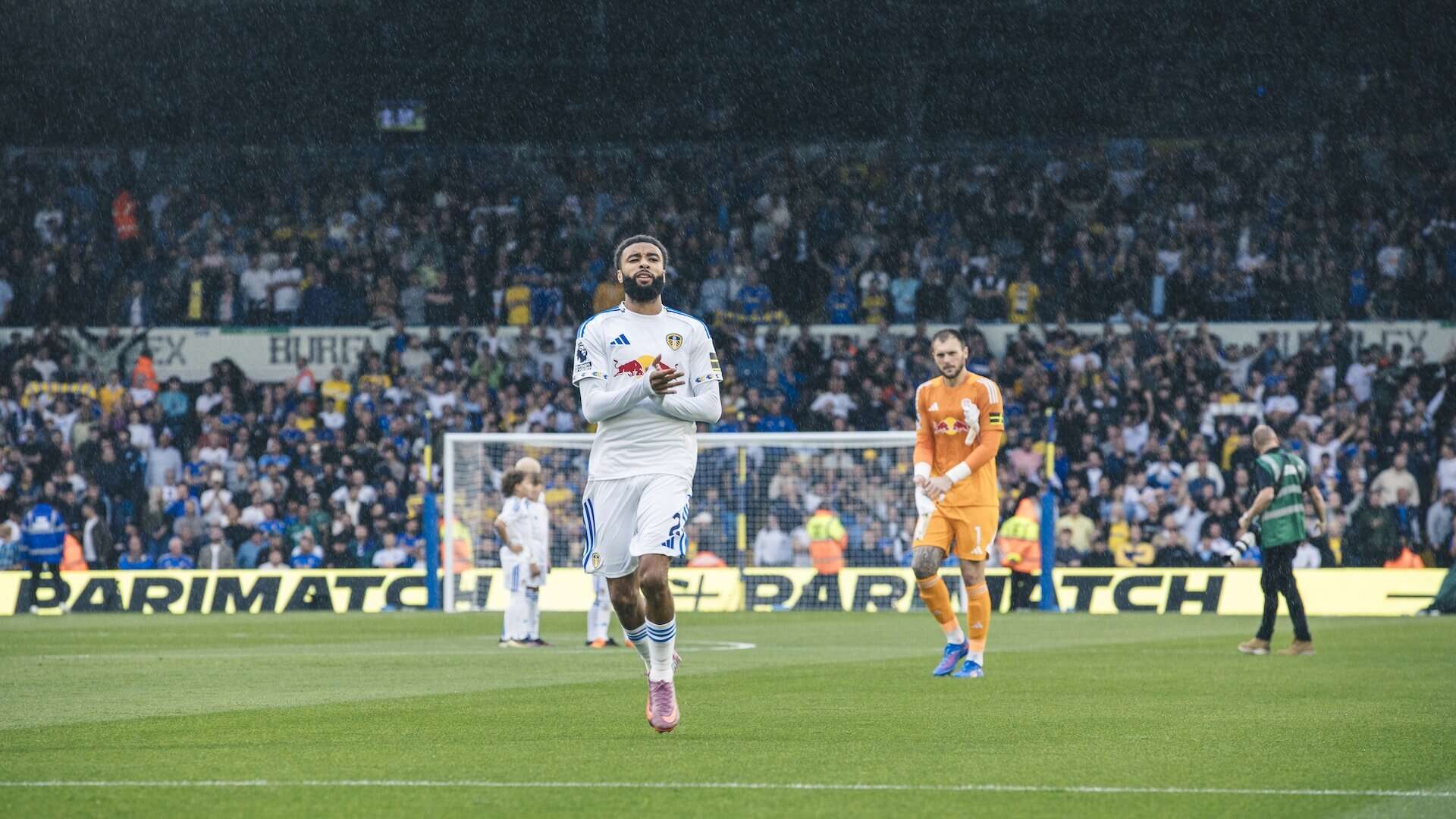 Jayden Bogle and Lucas Perri applauding the Leeds fans in the Kop ahead of kick off against Newcastle