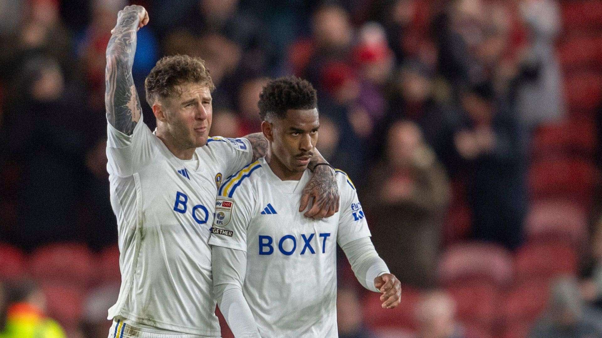Joe Rodon has a celebratory arm around Junior Firpo after the win over Middlesbrough. Rodon looks as rough as he always does, Firpo looks like he's going to be sick.