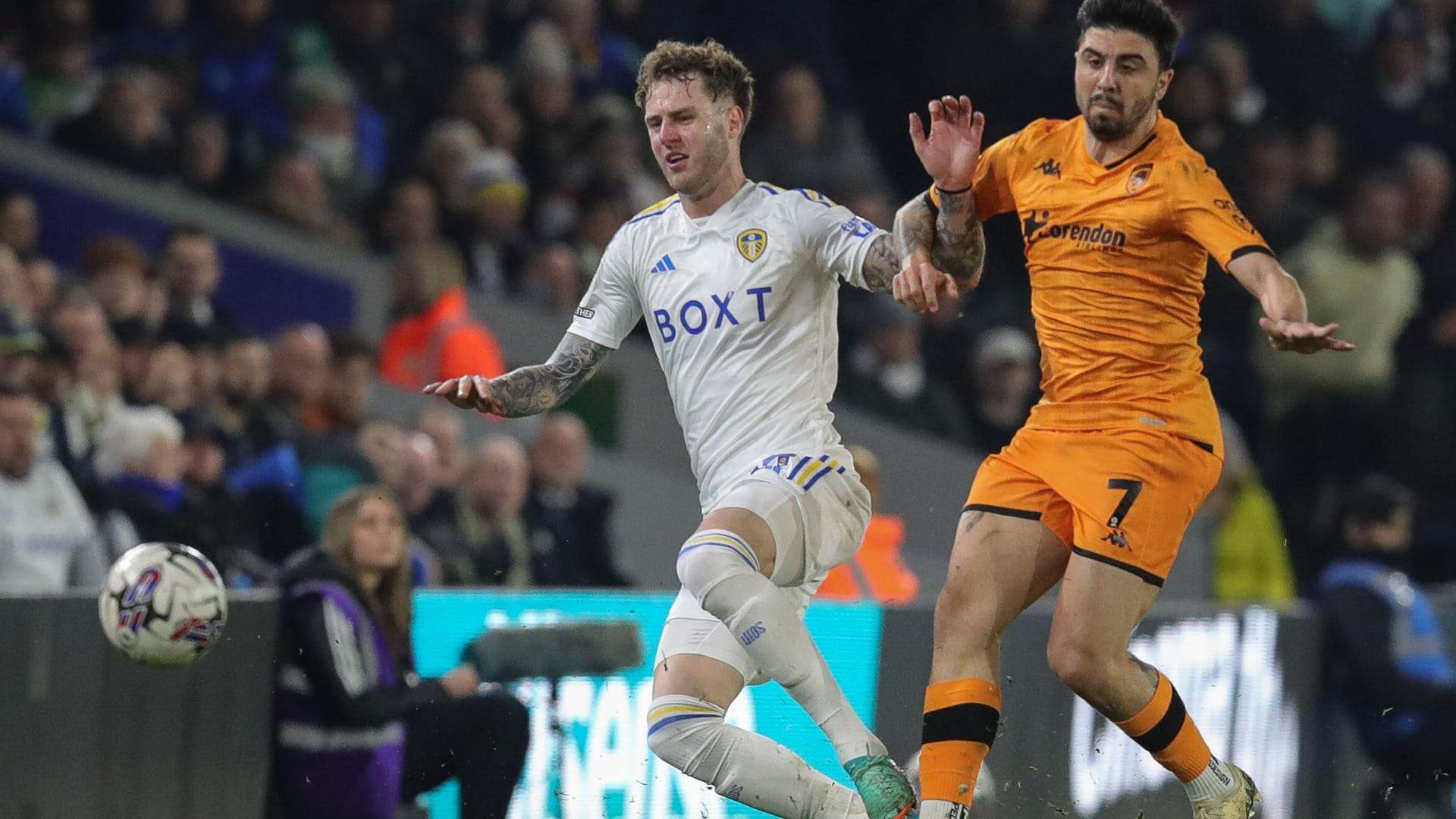 Joe Rodon chasing down and winning the ball off Ozan Tufan during Leeds versus Hull City