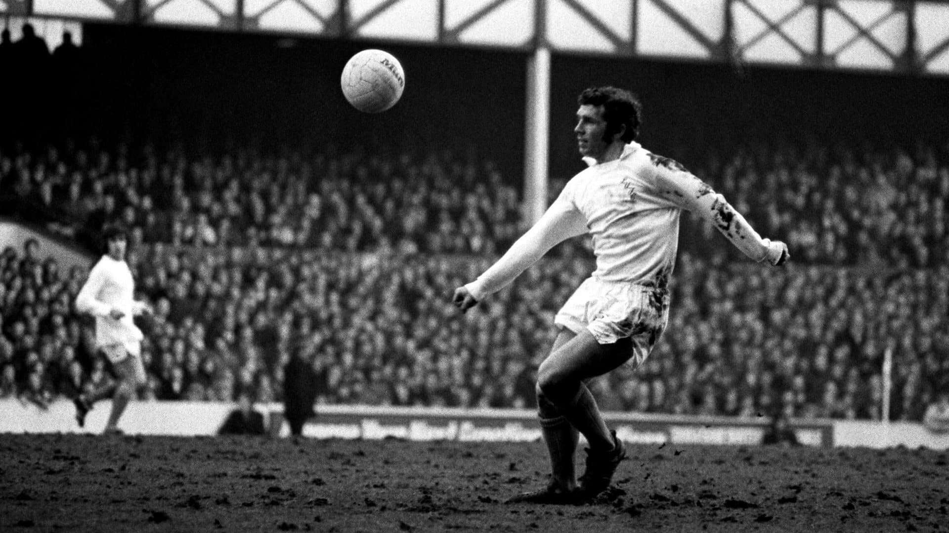 John Giles with a ball on a ploughed up field in 1972 — poetry