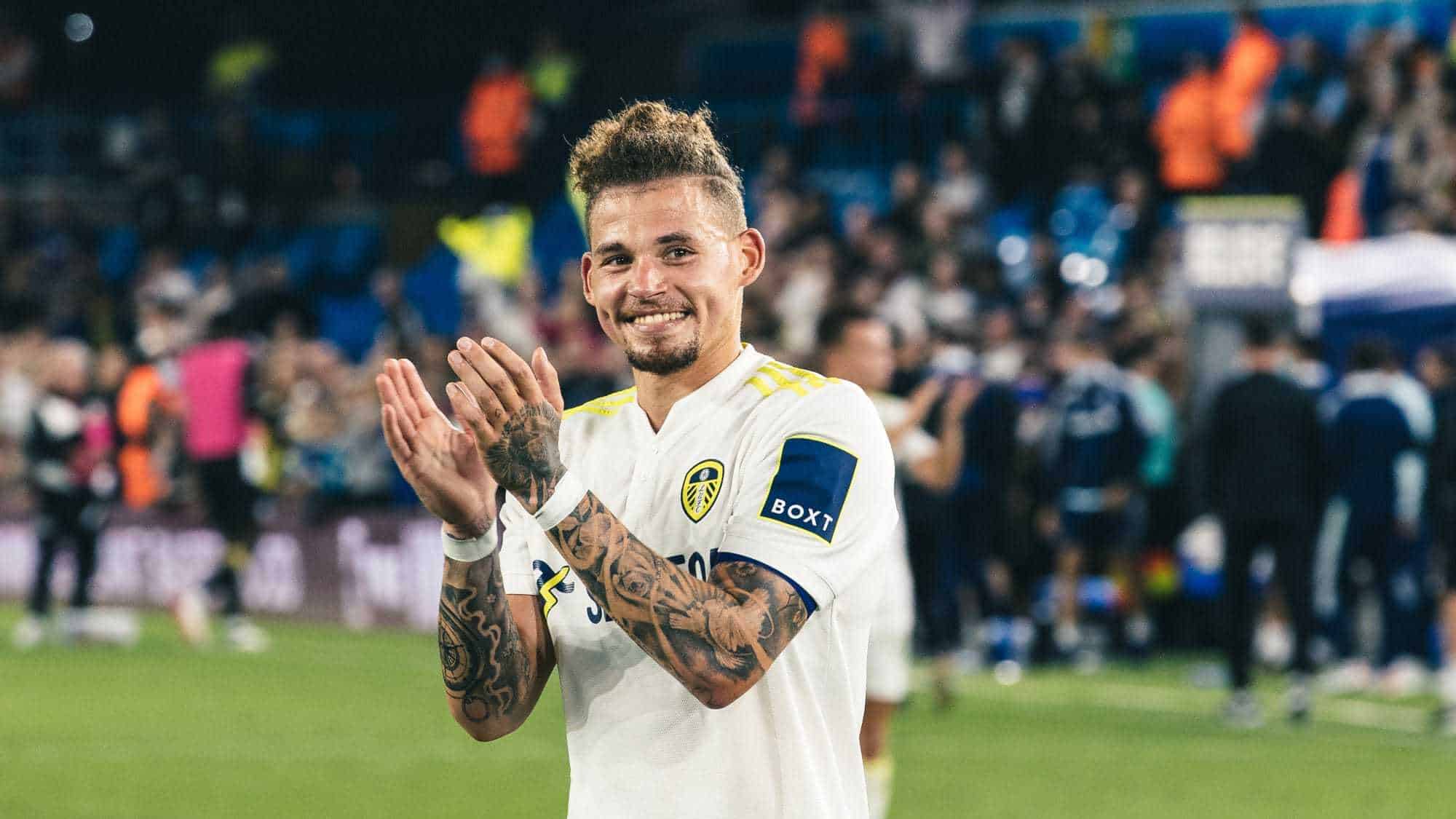 Kalvin Phillips clapping fans at the end of the game with the cheekiest grin