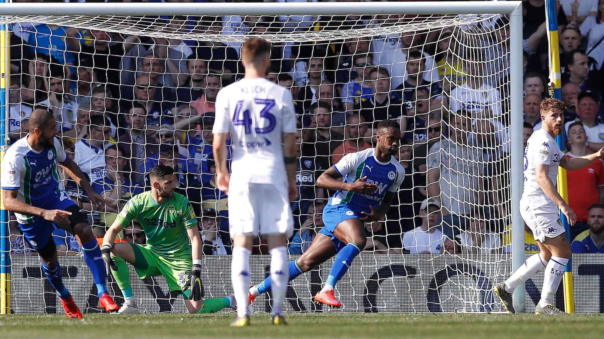 Mateusz Klich and Gaetano Berardi watch on in horror as Wigan score their second goal in *that* Easter defeat under Marcelo Bielsa. Kiko Casilla is also there watching on, so let's blame him