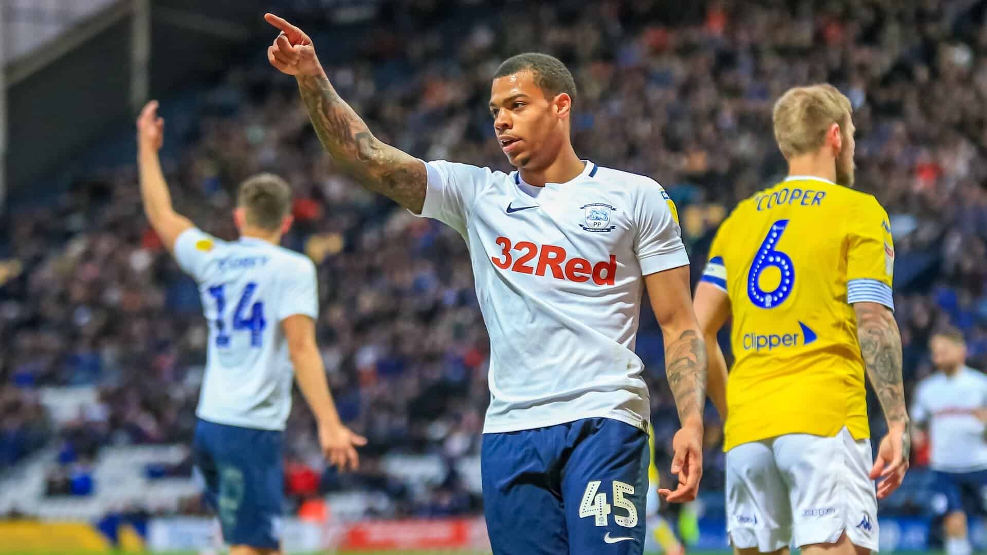 Lukas Nmecha playing against Leeds for Preston in 2019 at Deepdale, with Liam Cooper in the background wearing a really nice yellow shirt everyone seems to have forgotten about