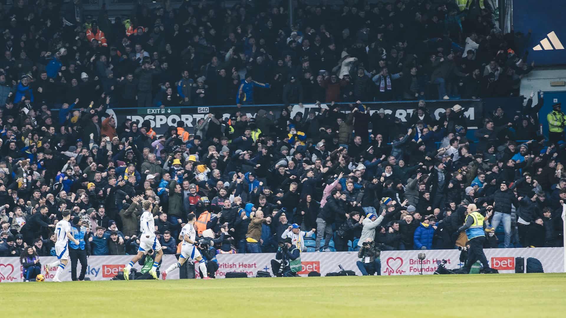 The limbs in the south stand as Manor Solomon celebrates in front of them after scoring yet again for Leeds United