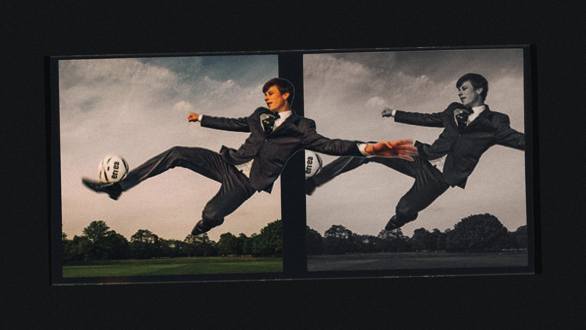A photo of Monty Gimpel performing a flying volley in a suit and tie. As you do