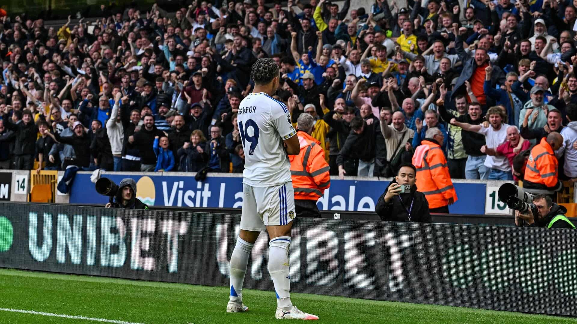 Noah Okafor folding his arms in front of the away end limbs after scoring Leeds' third at Wolves