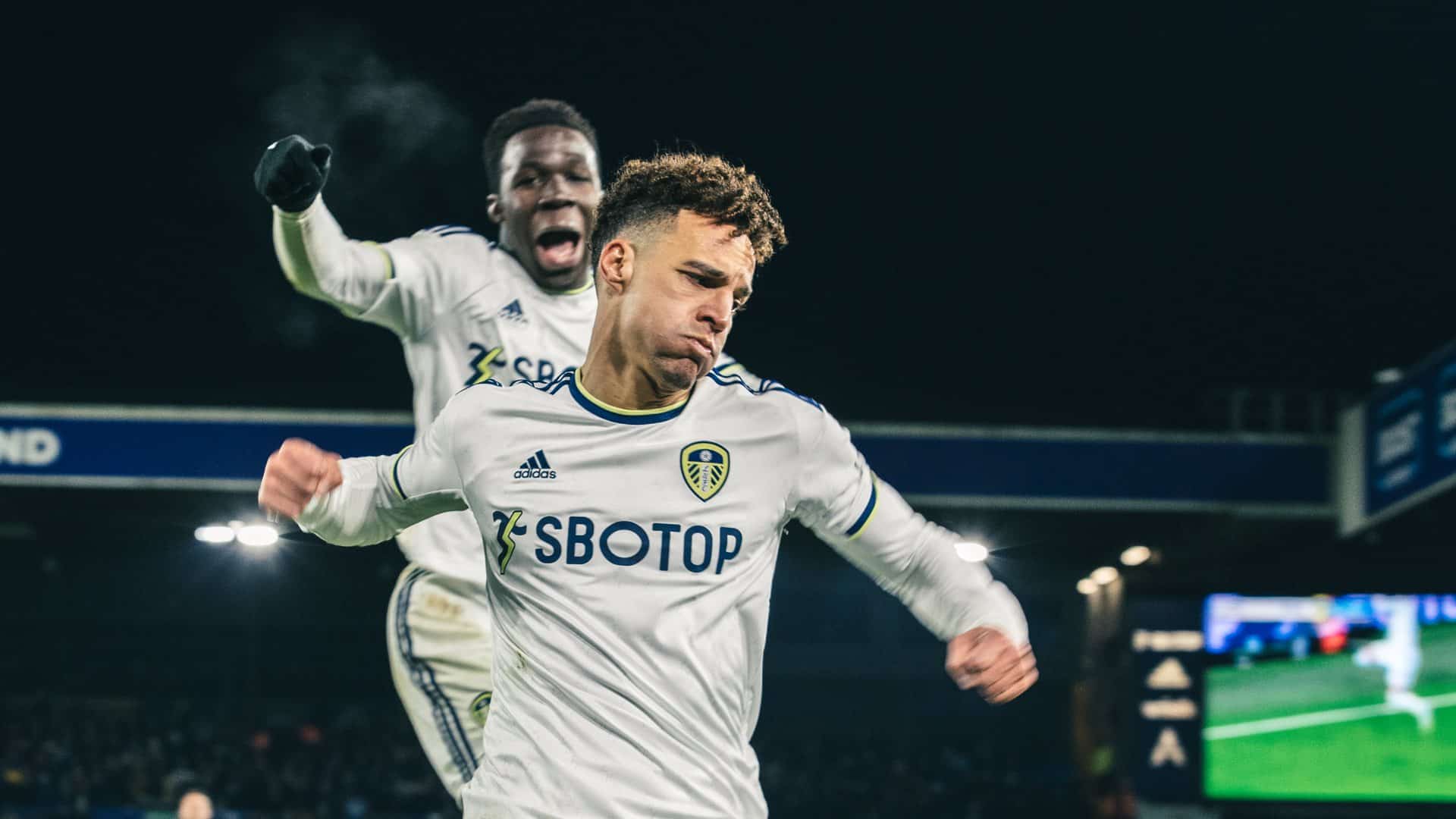 Rodrigo celebrating his goal against Real Sociedad with some air punching while Wilf Gnonto jumps for joy