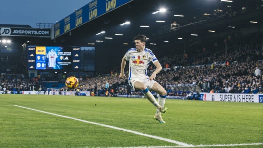 Sam Byram controlling a football on the left wing during a game at Elland Road. He looks resplendent