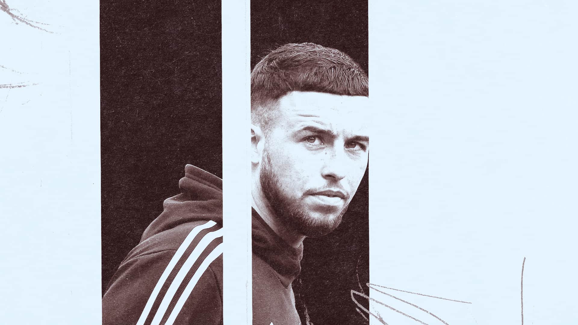 Sam Greenwood with his head turned in the direction of the camera, as if he's just spotted another Brentford fan to wind up