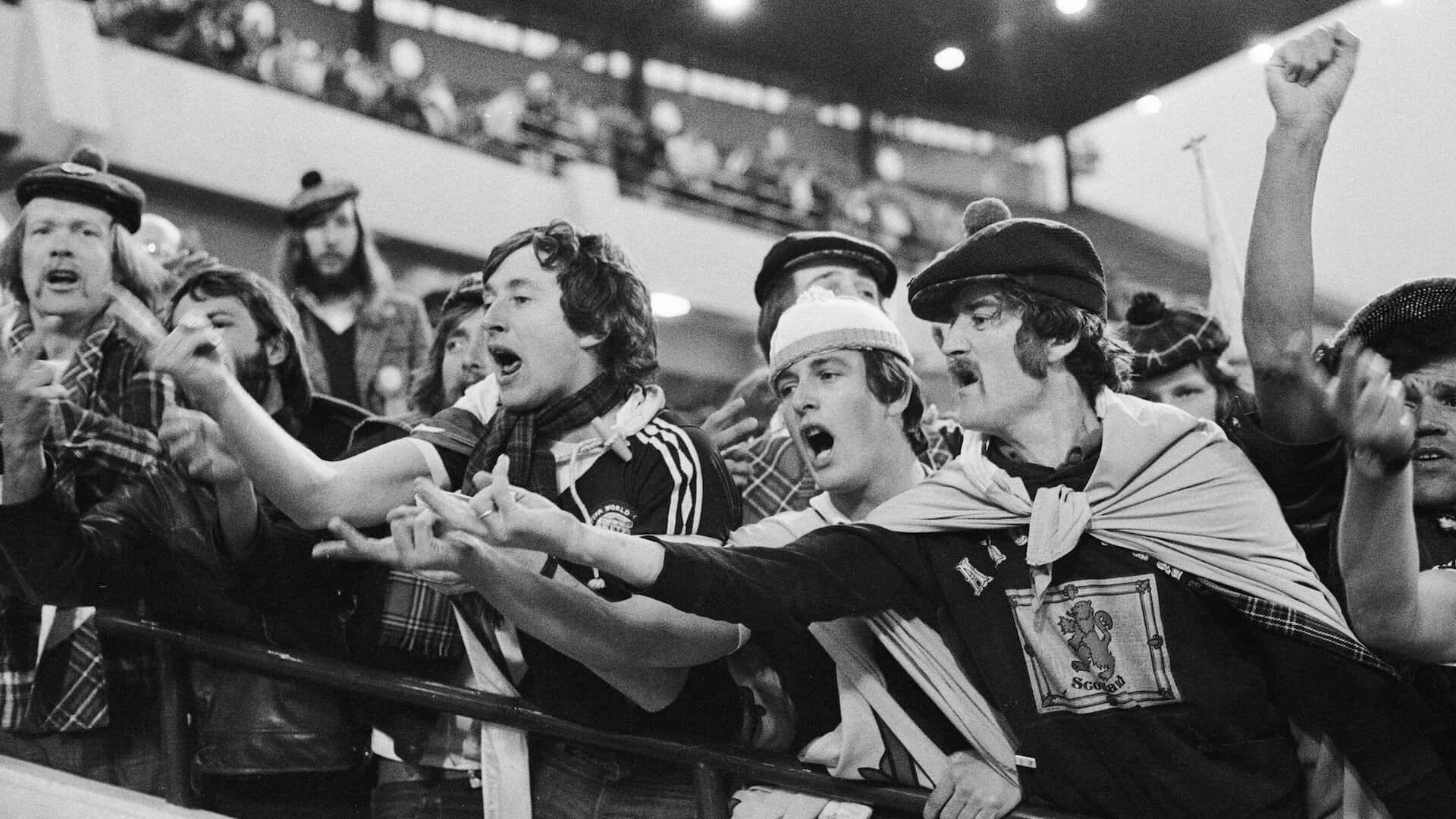 Scotland fans with superb haircuts and moustaches flicking the Vs and telling their team to fuck off as the players walk down the tunnel after a 1-1 draw with Iran at the 1978 World Cup