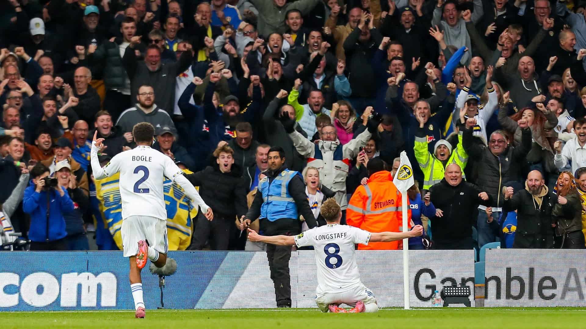 Sean Longstaff sliding towards the limbs in the Kop in celebration of his fucking belter against Bournemouth
