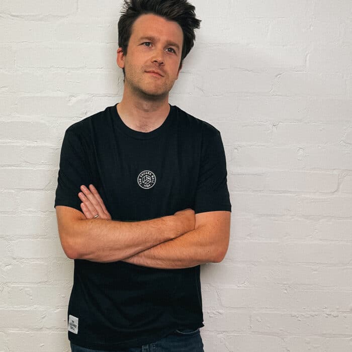 Poet Matt Abbott wearing our black t-shirt with a TSB logo embroidered in white to the centre of the chest