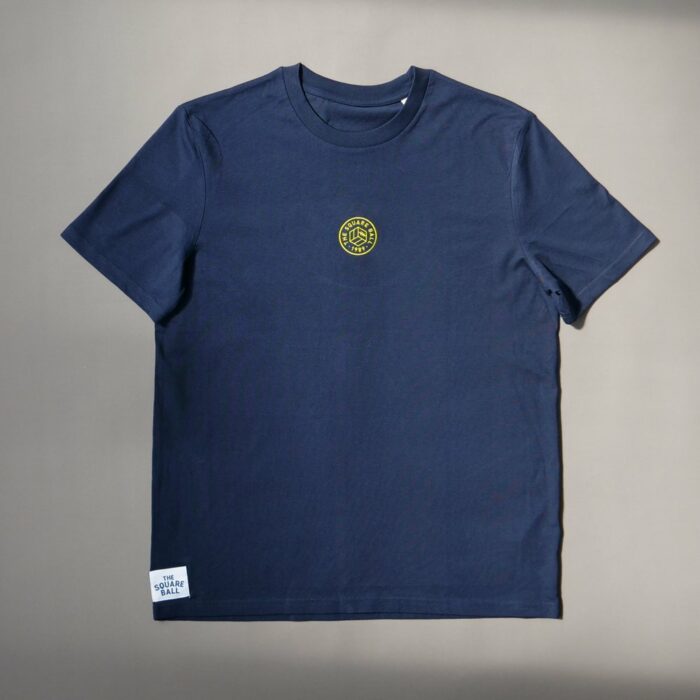 A flat photo of our navy t-shirt with a TSB logo embroidered in yellow to the centre of the chest
