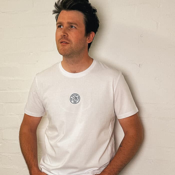 Poet Matt Abbott wearing our white t-shirt with a TSB logo embroidered in navy to the centre of the chest