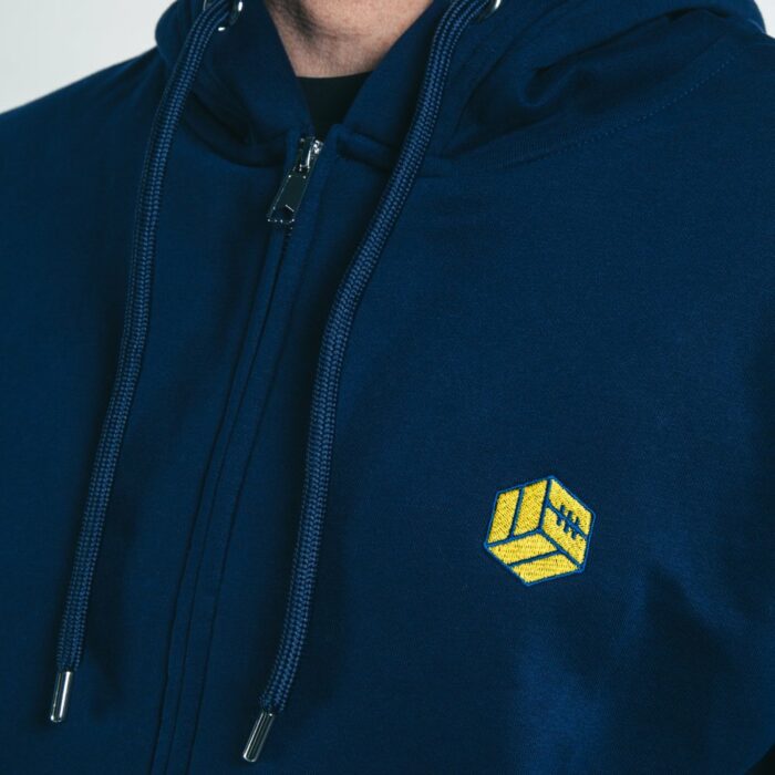 A close up of the top half of our TSB icon logo hoodie, showing the embroidered TSB icon