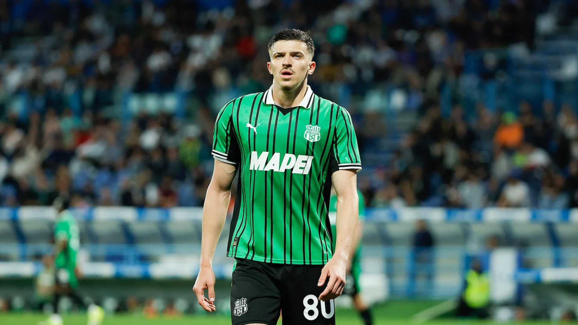 A photograph of Tarik Muharemovic playing for Sassuolo. The sheer size of his shoulders suggest he's built like he's been created in a video game