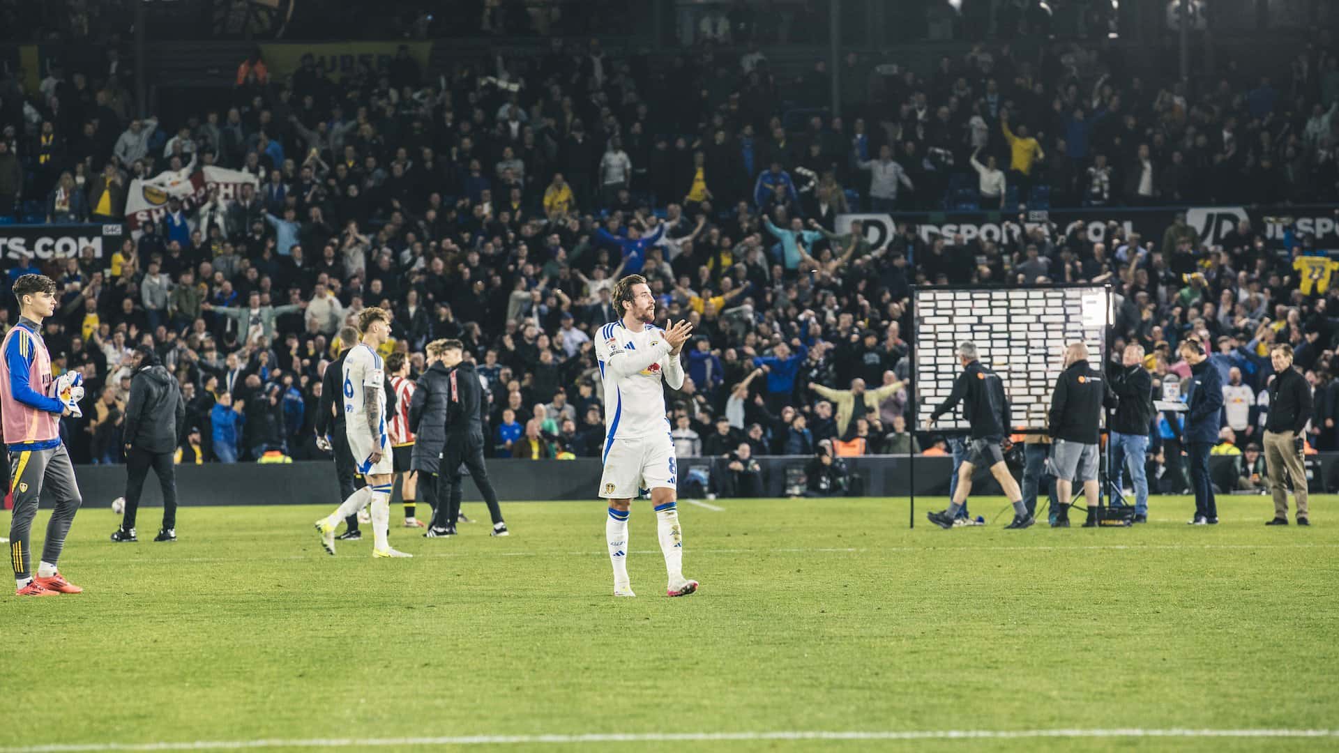 Joe Rothwell applauding the Elland Road crowd at full-time against Sheffield United with the South Stand going mental in the background