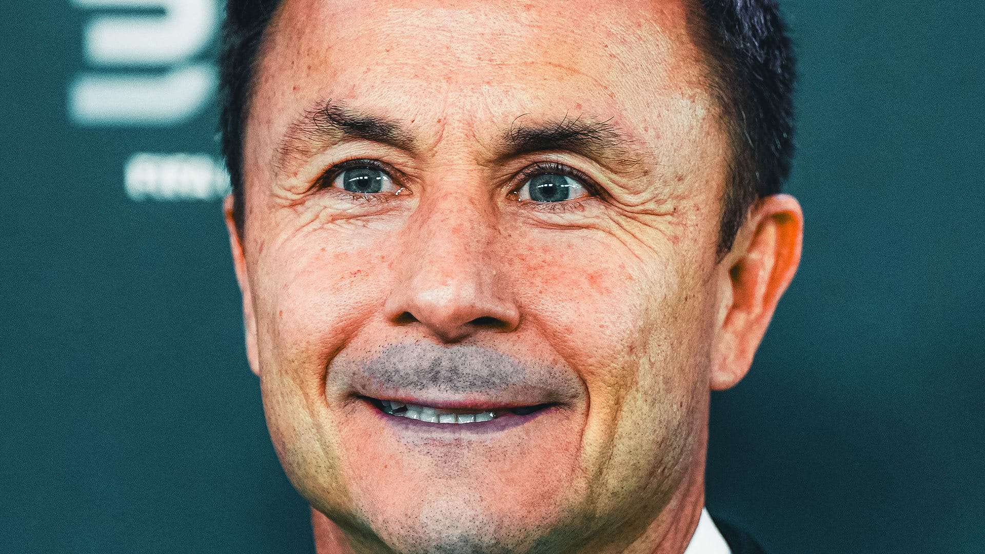 A far-too-close-up image of Dennis Wise smiling. At least I think he's smiling. It's hard to tell because his face is so inherently evil