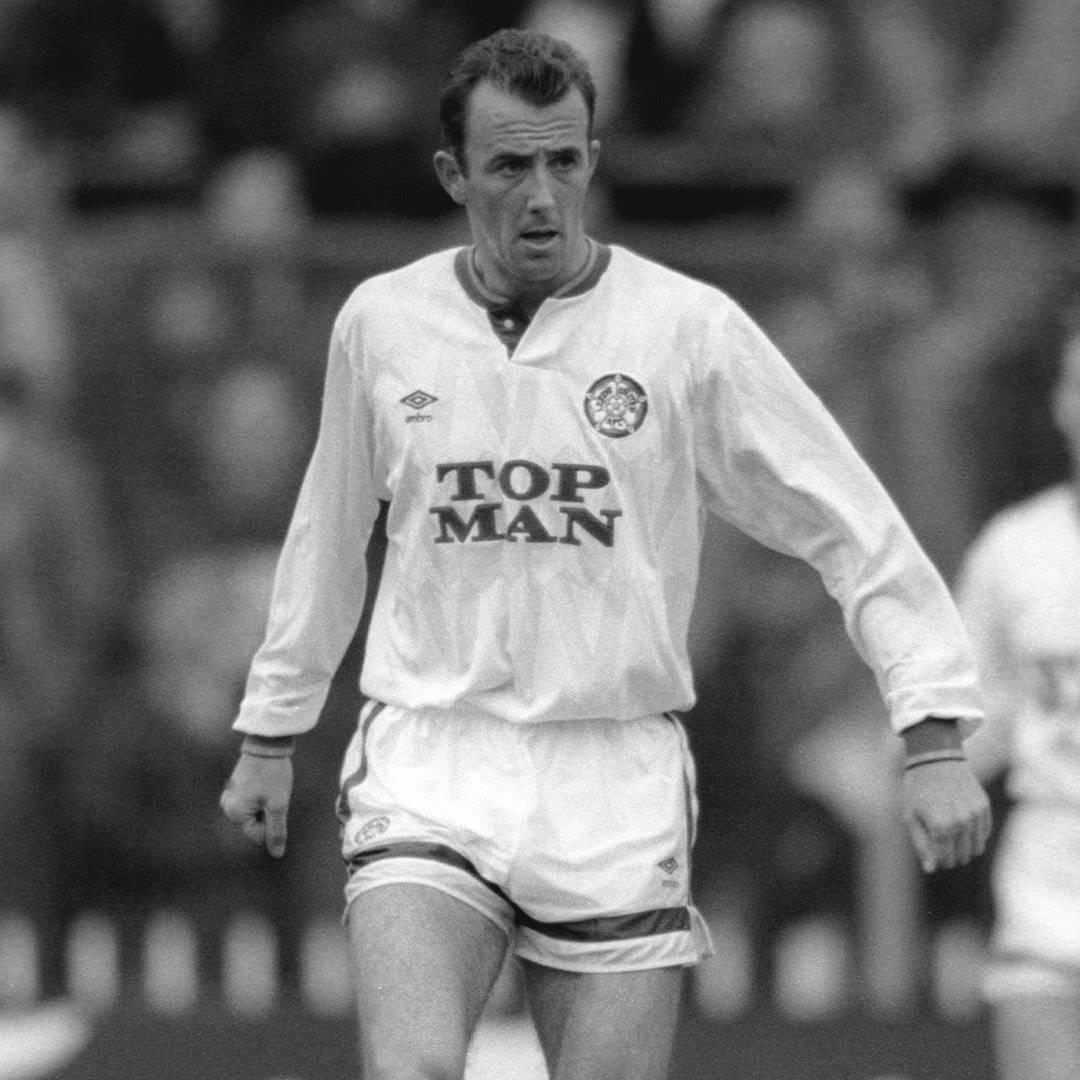 A black and white photo of Gary McAllister playing for Leeds